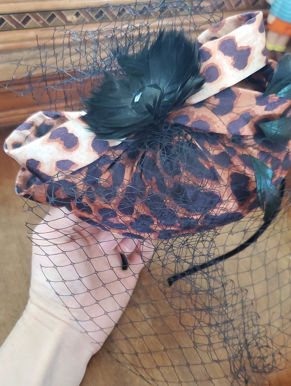 Leopard Print Veiled Fascinator with Black Feather Accent